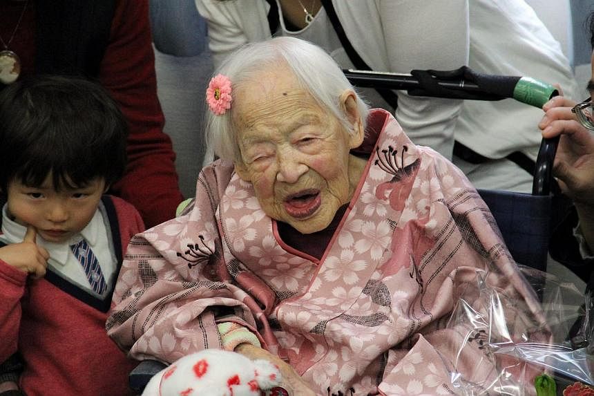 The world's oldest person, Misao Okawa, at a nursing home in Osaka on March 4, 2015, the eve of her 117th birthday. -- PHOTO: EPA