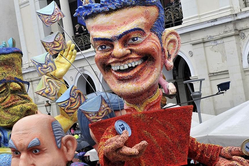 A float with a character depicting Greek Prime Minister Alexis Tsipras at a carnival parade last month. Mr Tsipras vowed to voters before he was elected that Greece would "finish with orders from abroad".
