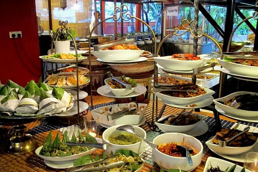 Malaysia has a thriving food scene as diverse as Singapore's but none of its restaurants has made the cut. That is inexplicable. Above, a buffet spread at Rebung Restaurant in Kuala Lumpur.