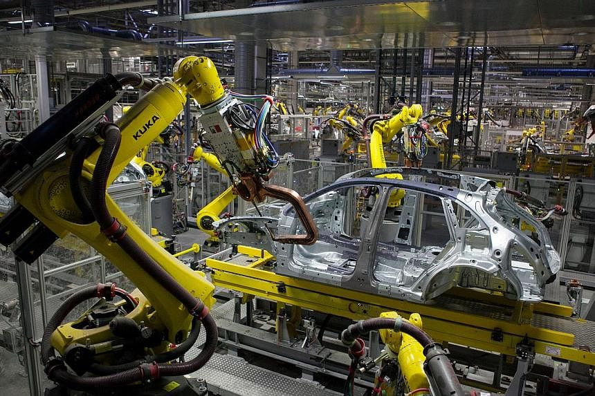 The first threat is that skills-biased technological change, such as robotics, favours a more urban and educated workforce and will result in growing unemployment and rising income inequality in emerging markets.&nbsp;-- PHOTO: BLOOMBERG