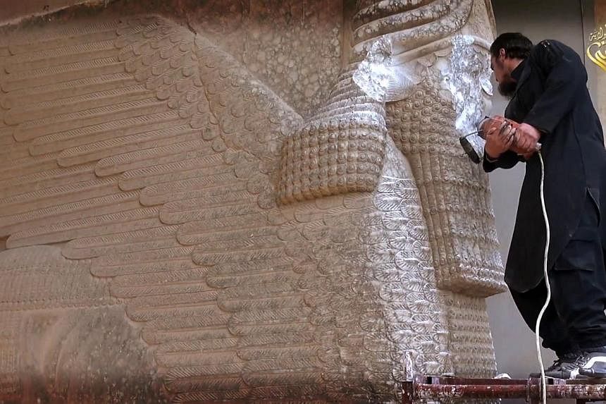 A video reportedly released by the Nineveh branch of ISIS on Feb 25 shows a militant destroying the statue of a lamassu, an Assyrian deity, with a jackhammer in the northern Iraqi governorate of Nineveh. The five-minute video also shows ISIS militant