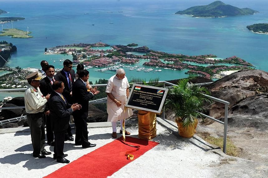 Mr Narendra Modi unveiling the plaque for a radar station in Seychelles on March 11. Media excitement about his visits to Seychelles, Mauritius and Sri Lanka is understandable, but one should not lose perspective. India is far from countering China's