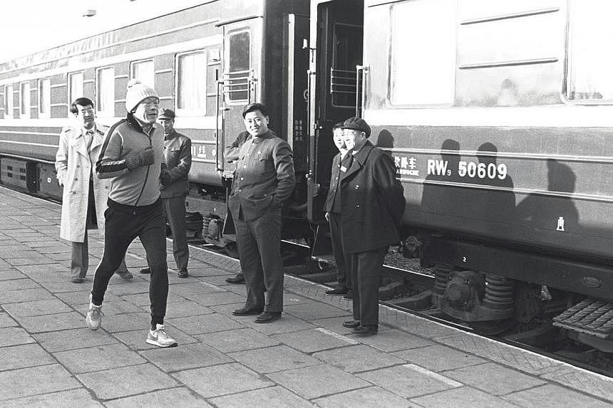 Mr Lee running in Chengde, China, in 1980. He turned to running after a surgeon friend told him that pushing the heart to its limits for as long as possible would improve heart muscle tone and get rid of the feeling of lethargy. -- ST FILE PHOTO