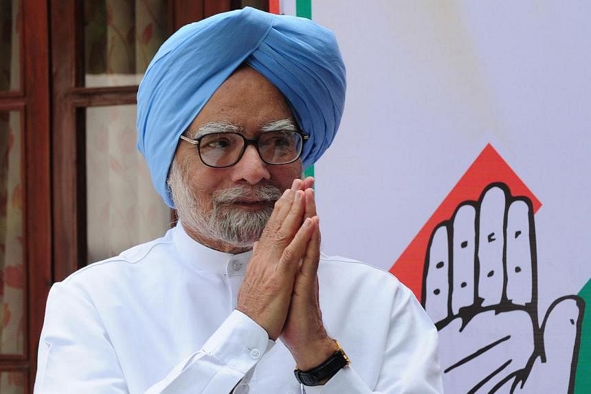 Former Indian PM Manmohan Singh gesturing as he arrives for the launch of an online and application based membership drive of the Congress Party in New Delhi on March 30, 2015.&nbsp;