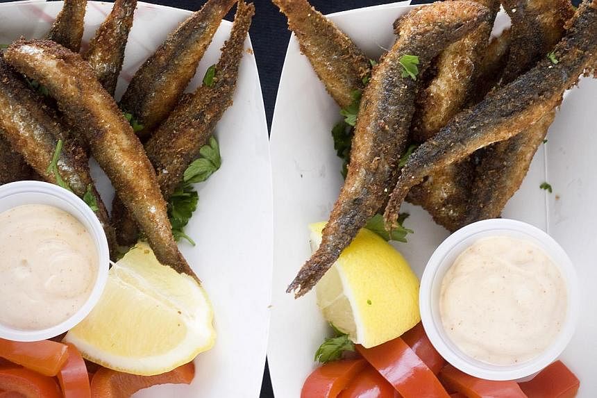 Lightly breaded and fried anchovies (above) are served with lemon, pickled sweet peppers and smoked paprika aioli. -- PHOTO: MAKANSUTRA