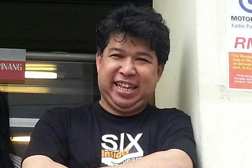 Mr Jahabar Sadiq, chief executive of The Malaysian Insider (TMI) news portal, seen in this picture shortly after he was released on police bail on Wednesday, April 1, 2015. He was arrested for sedition on March 31 along with Mr Ho Kay Tat, publisher 