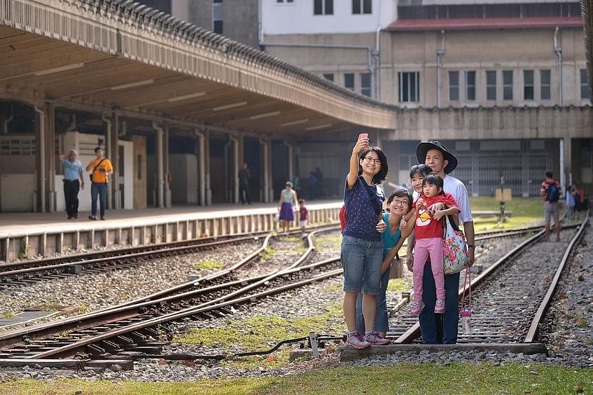 Visitors taking a picture of themselves at the former Tanjong Pagar Railway Station. It will open its doors to the public on Good Friday from 9am to 6pm. -- ST PHOTO: LIM SIN THAI