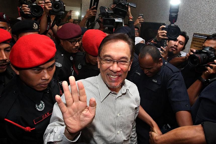 Anwar Ibrahim at the Syariah court of appeal in Kuala Lumpur on March 24, 2015.&nbsp;Anwar has been disqualified as Permatang Pauh MP, and a notice of vacancy of the Parliament seat has been issued to the Election Commission (EC), after a petition fo