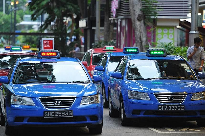 The Public Transport Council (PTC) has responded to concerns that taxi firms might violate the Competition Act by coming together to set the same taxi surcharges. -- ST PHOTO: LIM YAOHUI FOR THE STRAITS TIMES&nbsp;