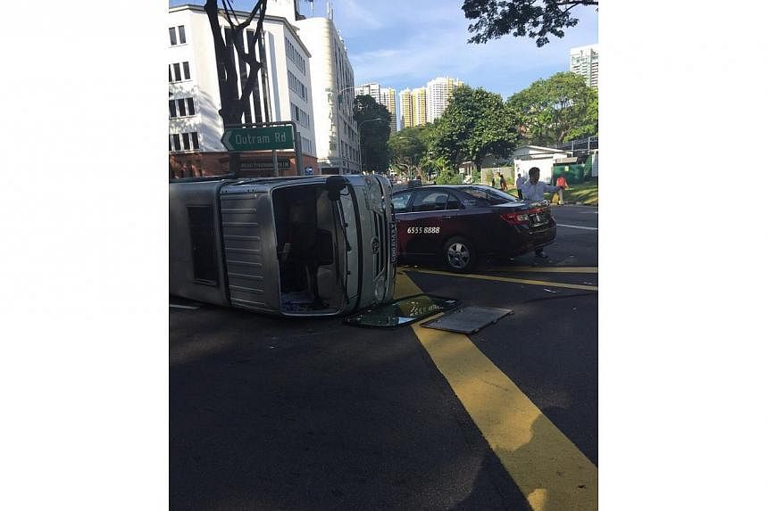 A taxi and a lorry collided at an Outram Road intersection on Thursday morning. -- PHOTO: REBECCA PAZOS