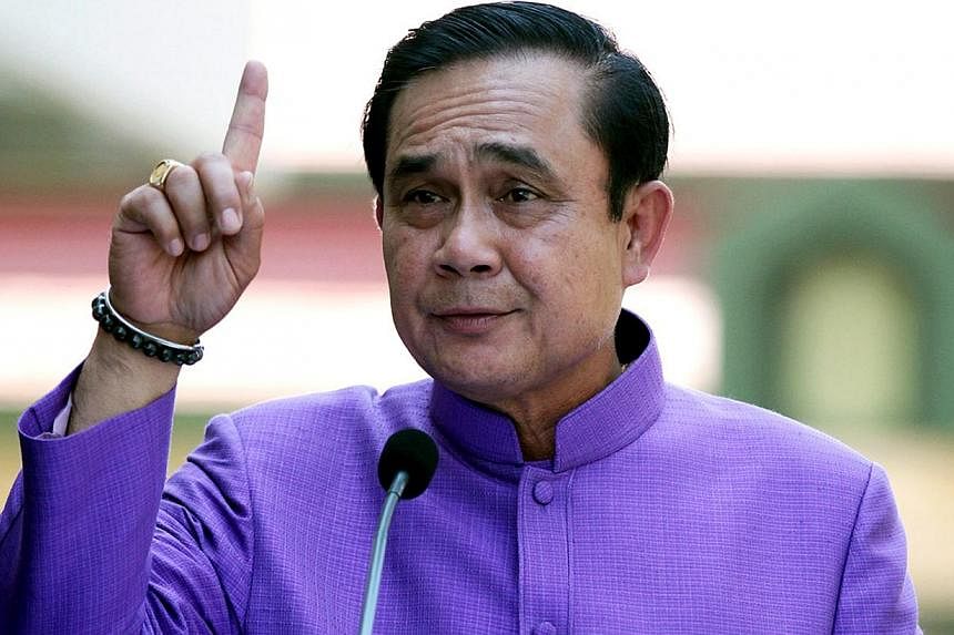 Human Rights Watch warned that the use of "unaccountable" power under Article 44 by Prime Minister General Prayut Chan-o-cha would mark Thailand's "deepening descent into dictatorship". -- PHOTO: EPA