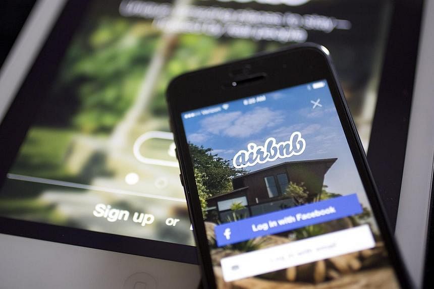 The Airbnb application is displayed on an Apple iPhone and iPad in this arranged photograph in Washington, DC, US, on March 21, 2014.&nbsp;The online lodging service Airbnb announced Thursday it was launching listings in Cuba for American visitors, i
