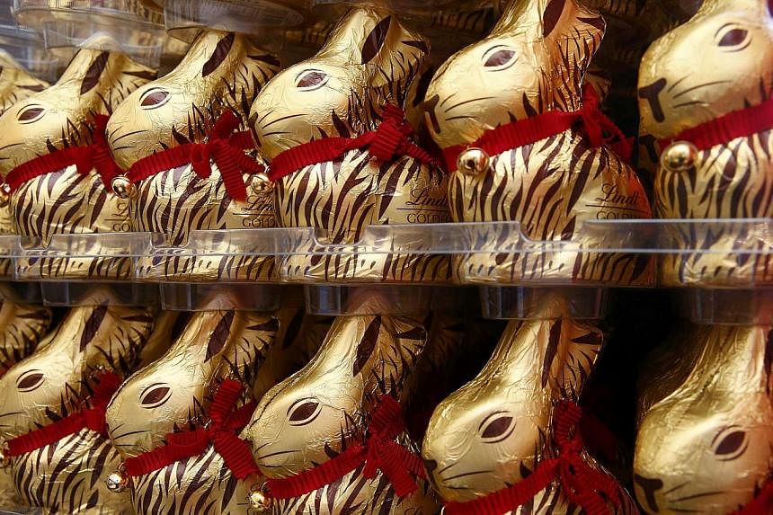 Gold-wrapped Easter chocolate bunnies are displayed during the annual news conference of Swiss chocolatier Lindt &amp; Spruengli in Kilchberg near Zurich on March 10, 2015. --PHOTO: REUTERS