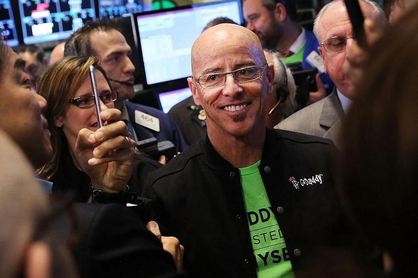 GoDaddy chief executive officer Blake Irving visits the floor of the New York Stock Exchange as the website hosting service makes its initial public offering on April 1, 2015 in New York City. -- PHOTO: AFP