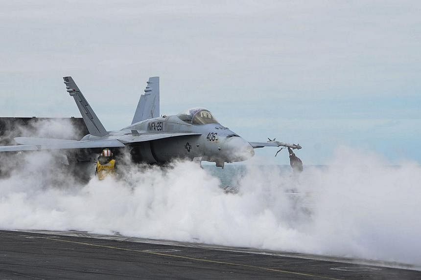 An F/A-18C Hornet prepares to launch from the flight deck of the USS Theodore Roosevelt (CVN 71) on March 22, 2015.&nbsp;China's Foreign Ministry expressed anger on Thursday after two US F-18 fighter jets landed in Taiwan, in a rare official contact 