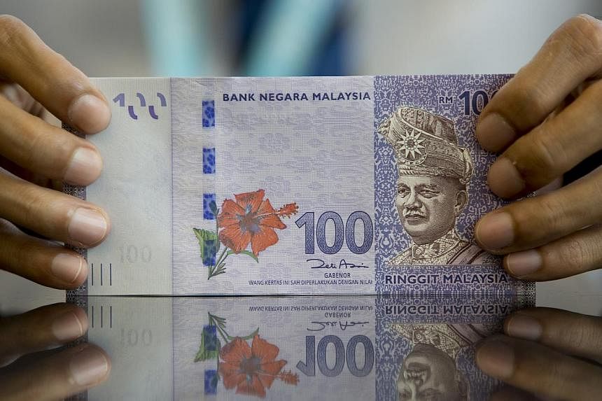 The Malaysian ringgit and the Indonesian rupiah both slumped to their lowest points versus the Singapore dollar since 1998 in January and December respectively, eroding how much gamblers from those countries can wager. -- PHOTO: BLOOMBERG&nbsp;