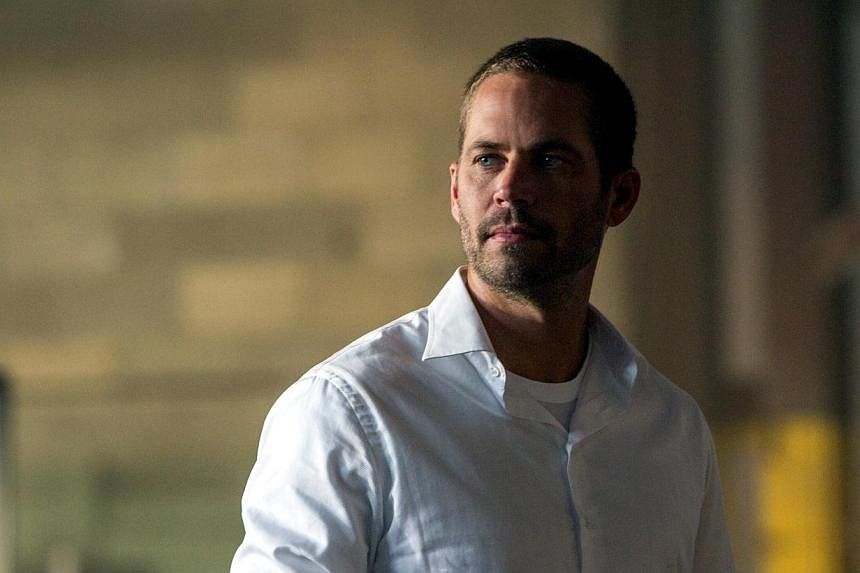 Paul Walker's death in November 2013 led to a temporary halt in production of Fast &amp; Furious 7, the latest movie in the successful series about illegal street racing that helped popularise his career. -- PHOTO: UIP