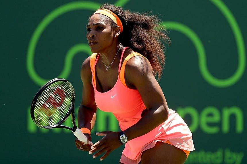 Serena Williams plays Sabine Lisiki of Germany at the Miami Open on April 1, 2015. Williams booked her semi-final berth at Miami on Wednesday with the 700th match win of her career.&nbsp;-- PHOTO: AFP