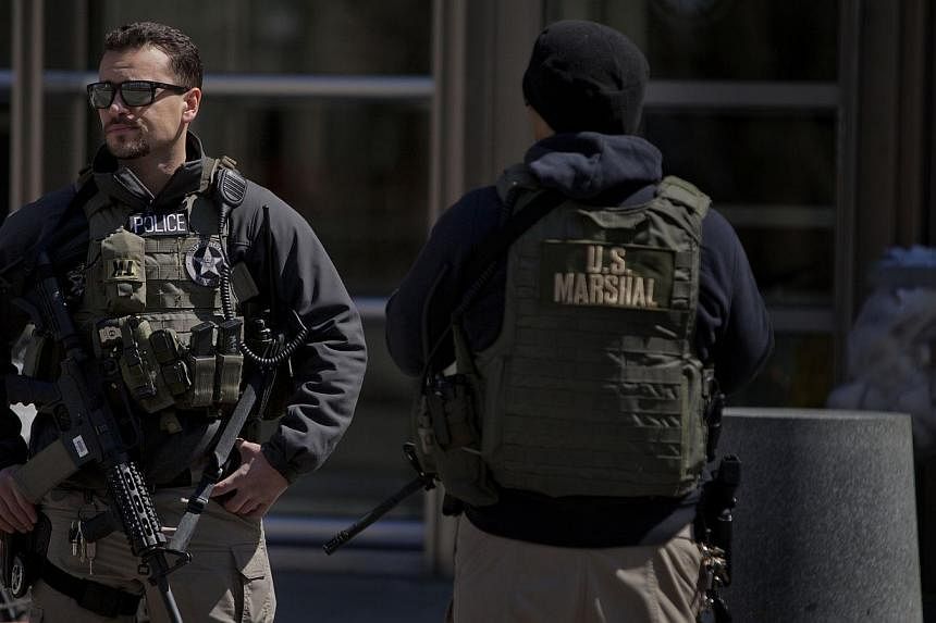 US Marshals stand outside the US Federal Court in Brooklyn during the arraignment on terrorism charges of two Queens women on April 2, 2015 in New York City.&nbsp;Two American women inspired by Al-Qaeda and extremists in Syria were arrested in New Yo