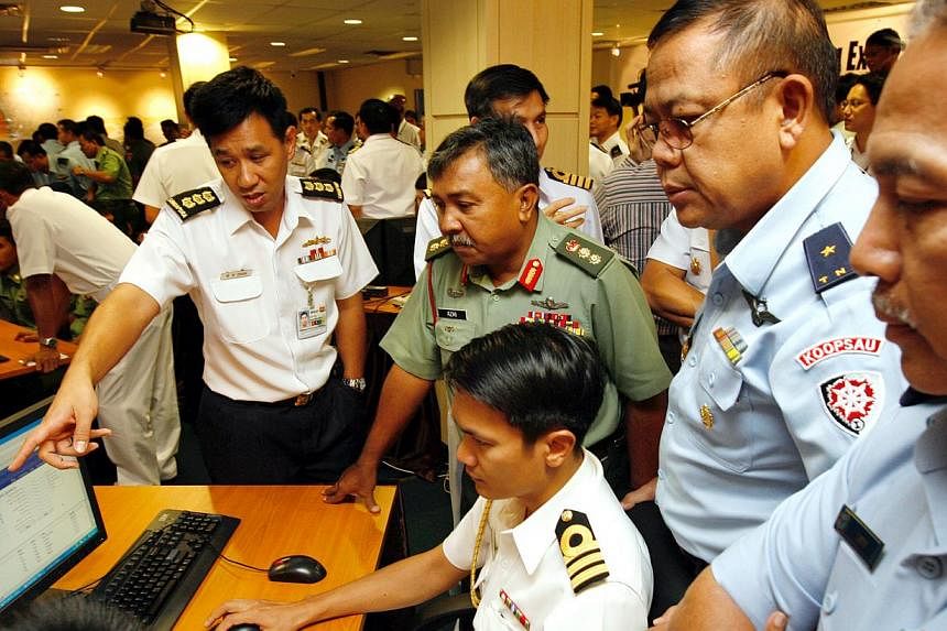 Military officers from Malaysia, Indonesia, Thailand and Singapore at the inaugural Malacca Strait Patrols Information System exercise held at Tuas Naval Base in March 2008. The system allows information about an incident to be passed on quickly to a