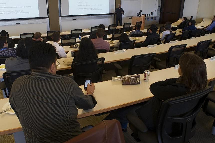 Students at a University of Pennsylvania's Wharton School lecture in San Francisco. Even if scholars agree on the importance of publishing in the popular media, the system plays against them. Publications in peer-reviewed journals continue to be the 