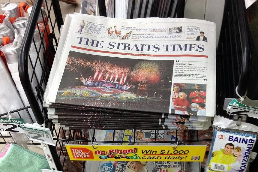 A rack displaying copies of The Straits Times at a Shell petrol station on Braddell Road. -- PHOTO: ST FILE