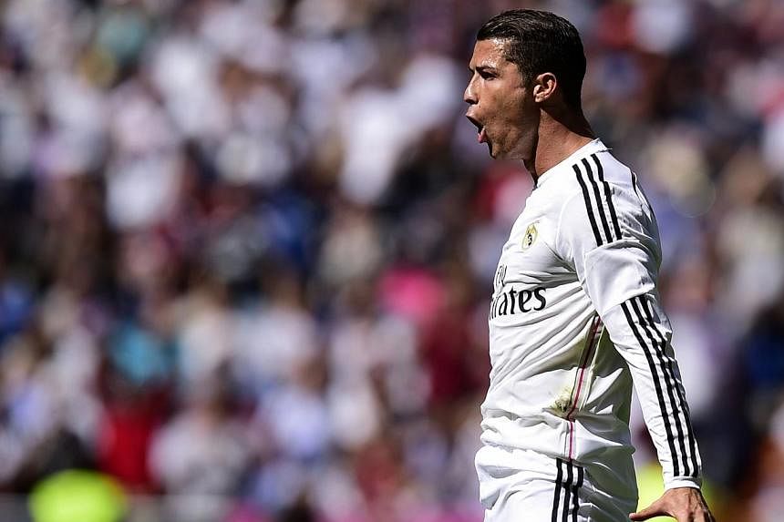 Ronaldo fires Real top, Barca held by Sevilla, Football