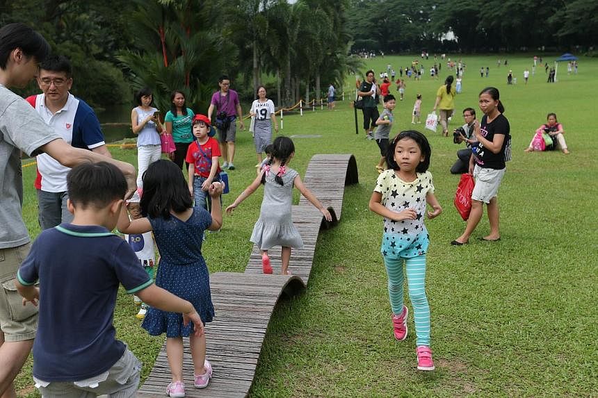 Fourteen benches from the former National Stadium have been recycled and permanently installed at the Istana's Swan Pond by the Urban Redevelopment Authority. -- ST PHOTO: ONG WEE JIN