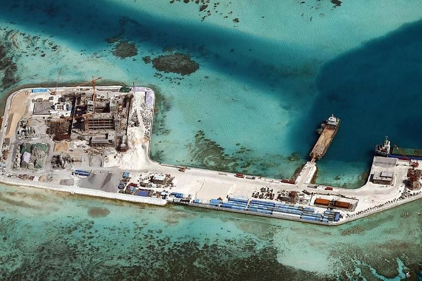 A recent handout picture from the Philippine armed forces' public affairs office shows construction by China at Chigua Reef in the disputed Spratly Islands on Feb 19. While China is justified in exercising its sovereign right, it should also be sensi
