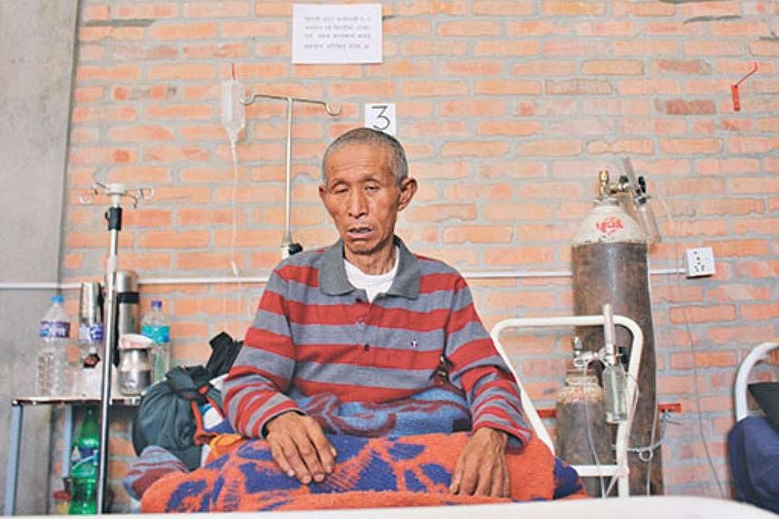 67-year-old Dal Ram Ghale of Barpak village of Gorkha, the epicentre of the earthquake, recuperating at Gorkha District Hospital. -- PHOTO: THE KATHMANDU POST/ ASIA NEWS NETWORK&nbsp;
