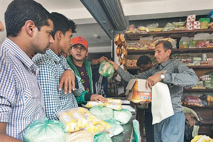 People buy daily essentials at a shop in Sindhupalchok. -- PHOTO: THE KATHMANDU POST/ ASIA NEWS NETWORK &nbsp;