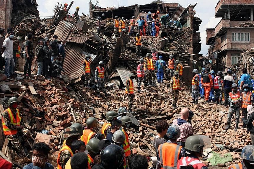 This handout photo taken on April 29, 2015, and released by the International Federation of Red Cross and Red Crescent Societies (IFRC) shows workers taking part in a rescue operation at Kolache-2 in Bhaktapur near Kathmandu, four days after the 7.8 