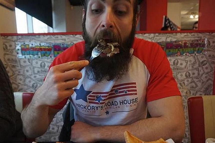 Extreme eater Adam Moran, 29. -- PHOTO: SCREENGRAB FROM BEARDMEATSFOOD.CO.UK