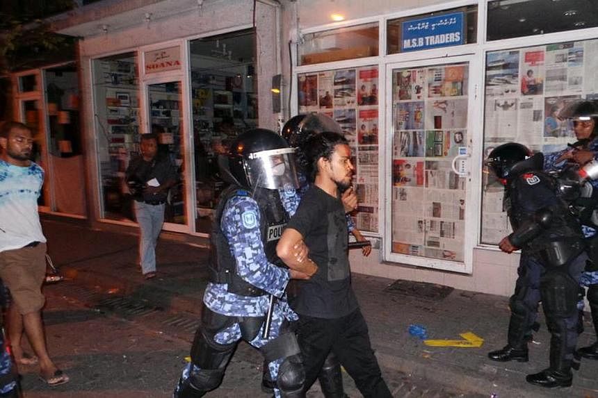 Maldives security personnel arrest opposition activists during an anti-government rally in Male, Maldives, on May 2, 2015. -- PHOTO: EPA