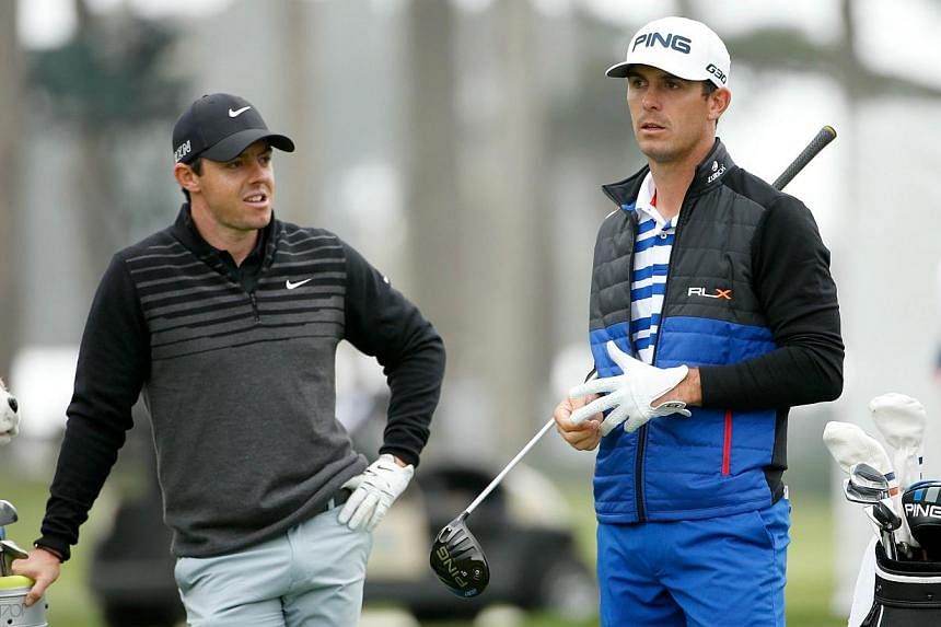 Rory McIlroy (left) of Northern Ireland talks to Billy Horschel (right) of the USA while they wait to tee off on the 16th hole during round three of the World Golf Championships Cadillac Match Play at TPC Harding Park in San Francisco, California on 