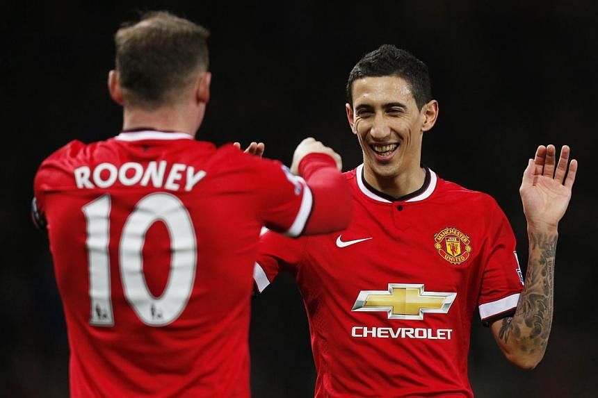 Louis van Gaal expects Angel di Maria (above right) to remain at Manchester United despite being disappointed by the British record signing's lacklustre first season in the Premier League. -- PHOTO: REUTERS