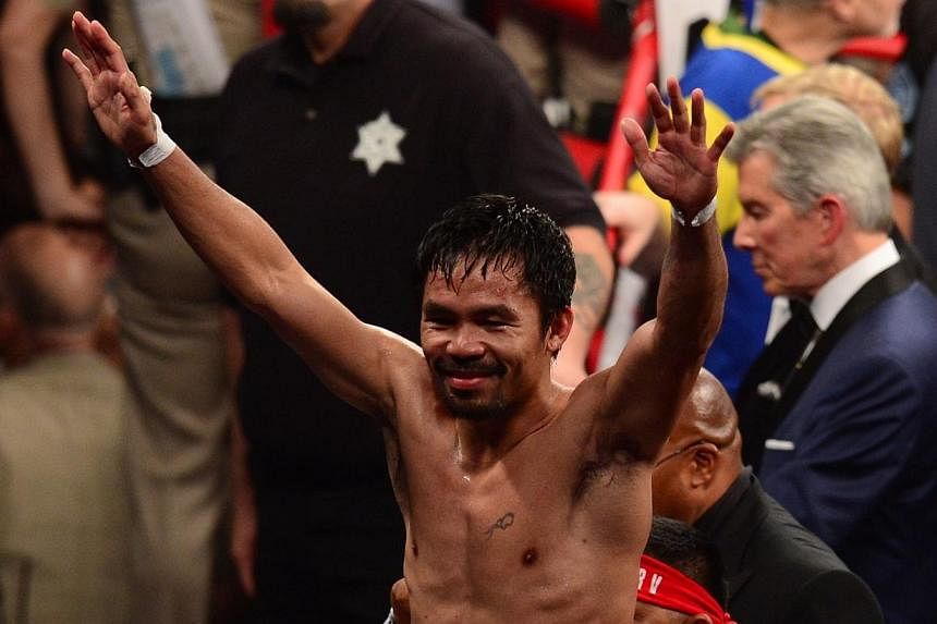 Manny Pacquiao reacts after his fight against Floyd Mayweather Jr. in a welterweight unification bout on May 2, 2015 at the MGM Grand Garden Arena in Las Vegas, Nevada. -- PHOTO: AFP