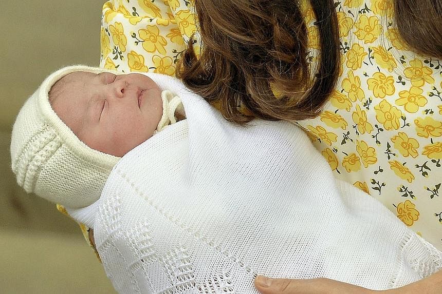 Britain's Catherine, Duchess of Cambridge, holds her baby daughter outside the Lindo Wing of St Mary's Hospital, in London, Britain on May 2, 2015. -- PHOTO: REUTERS