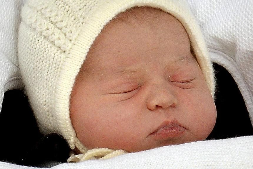 The baby daughter of Britain's Prince William and Catherine, Duchess of Cambridge, sleeps as she is carried in a car seat from the Lindo Wing of St Mary's Hospital, in London, May 2, 2015. -- PHOTO: REUTERS&nbsp;