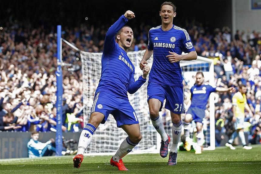 Eden Hazard celebrates after scoring the first goal for Chelsea. The English football club bagged a fourth English Premier League title with three more games to go on Sunday. -- PHOTO: REUTERS&nbsp;