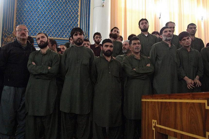 Unidentified suspects linked to the mob killing of a woman in the Afghan capital of Kabul&nbsp;attend their primary court trial in Kabul, Afghanistan on May 2, 2015. -- PHOTO: EPA