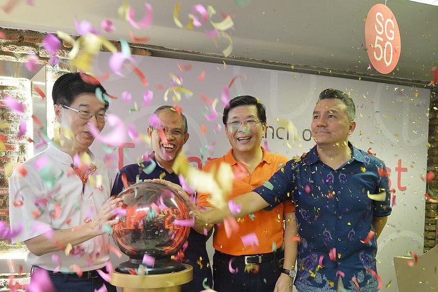 (From left) Mr Ang Hak Seng, Chief Executive Director, People's Association, Minister Masagos Zulkifli, Mr Ng Cheng Huat, and Mr Suhaimi Rafdi at the open house for the new Tampines West CC on May 3, 2015. -- ST PHOTO: ALPHONSUS CHERN &nbsp;