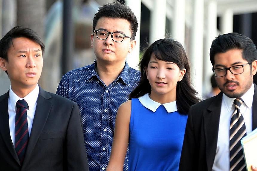 Yang&nbsp;Kaiheng (second left) and Ai Takagi (second right), the couple behind socio-political website The Real Singapore (TRS)&nbsp;have had their licence to operate the website suspended by the Media Development Authority (MDA). -- ST PHOTO:&nbsp;