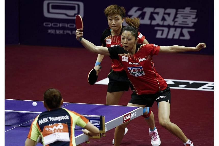 Feng Tianwei (left) and Yu Mengyu (right) of Singapore in action against Park Young Sook and Yang Ha Eun of South Korea in the quarterfinals of the Women's Doubles of the 2015 World Table Tennis Championships at the Suzhou International Expo Centre i