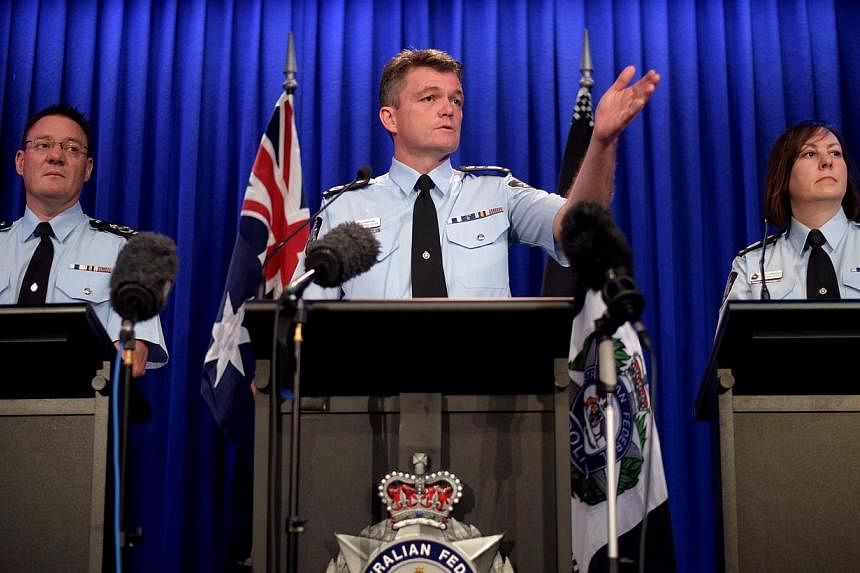 (Left to right) Australian Federal Police (AFP) Deputy Commissioner Michael Phelan, AFP Commissioner Andrew Colvin and Deputy Commissioner Leanne Close speak to the media during a press conference in Canberra, Australia, on May 4, 2015. -- PHOTO: EPA
