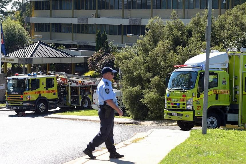 Two Hazardous Materials (HAZMAT) teams of the Canberra fire brigade respond to a suspicious package at the Indonesian Embassy in Canberra, Australia, on May 4, 2015. -- PHOTO: EPA