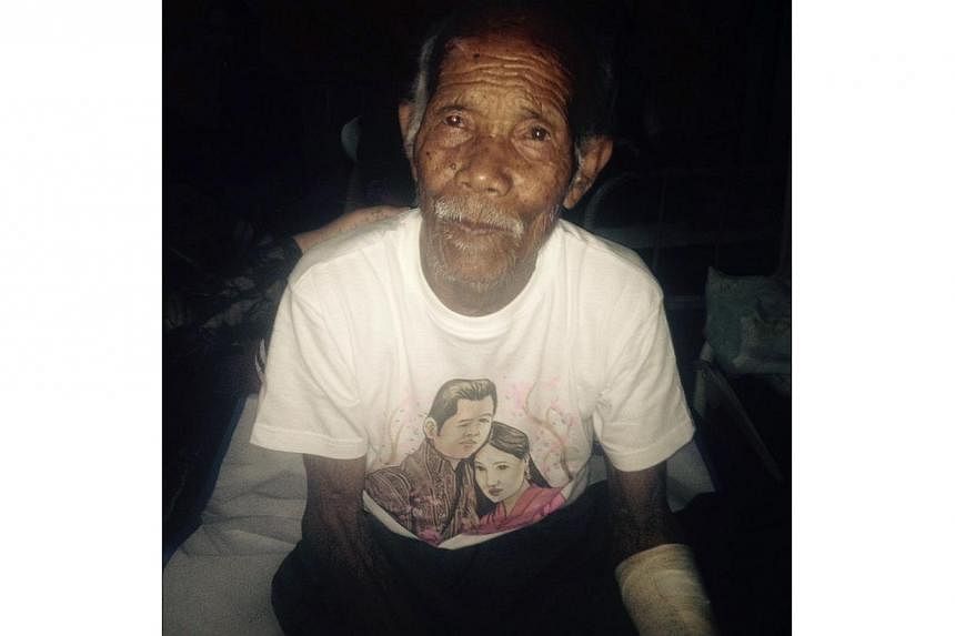 Funchu Tamang, 101, sits on a bed in a hospital in Nuwakot district on May 3, 2015 around 80 kilometres north-west of Kathmandu where he was taken after being rescued from his collapsed home a day earlier. -- PHOTO: AFP&nbsp;