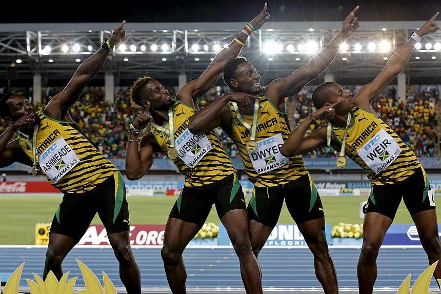 Jamaica's 4x200 relay team strike a pose on the medal podium after winning the event at the IAAF World Relays Championships in Nassau Bahamas on May 3, 2015. From left are Nickel Ashmeade, Jason Livermore, Rasheed Dwyer and Warren Weir. -- PHOTO: REU