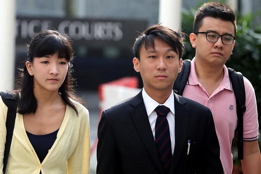 Ai Takagi (left) and Yang Kaiheng (right), the two editors behind socio-political website The Real Singapore, arriving at the court with their lawyer Choo Zheng Xi (centre) on May 4, 2015. Mr Yang, 26, has applied to return to Australia as his father
