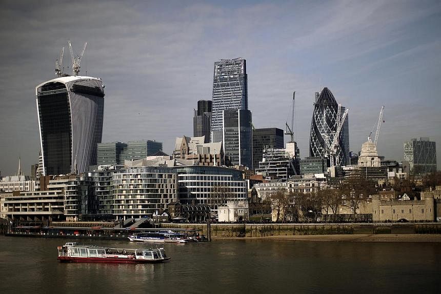 Skyscrapers including 20 Fenchurch Street, also known as the "Walkie-Talkie," left, stand on the skyline of the City of London in London, U.K., on Wednesday, March 5, 2014. The Consumers Association of Singapore (Case) said on Monday it is "very conc